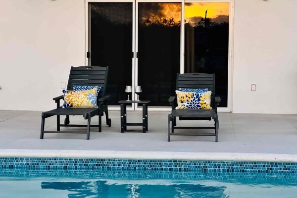 Comfortable sun loungers beside the private swimming pool at Blue Water Villa in Grand Turk.